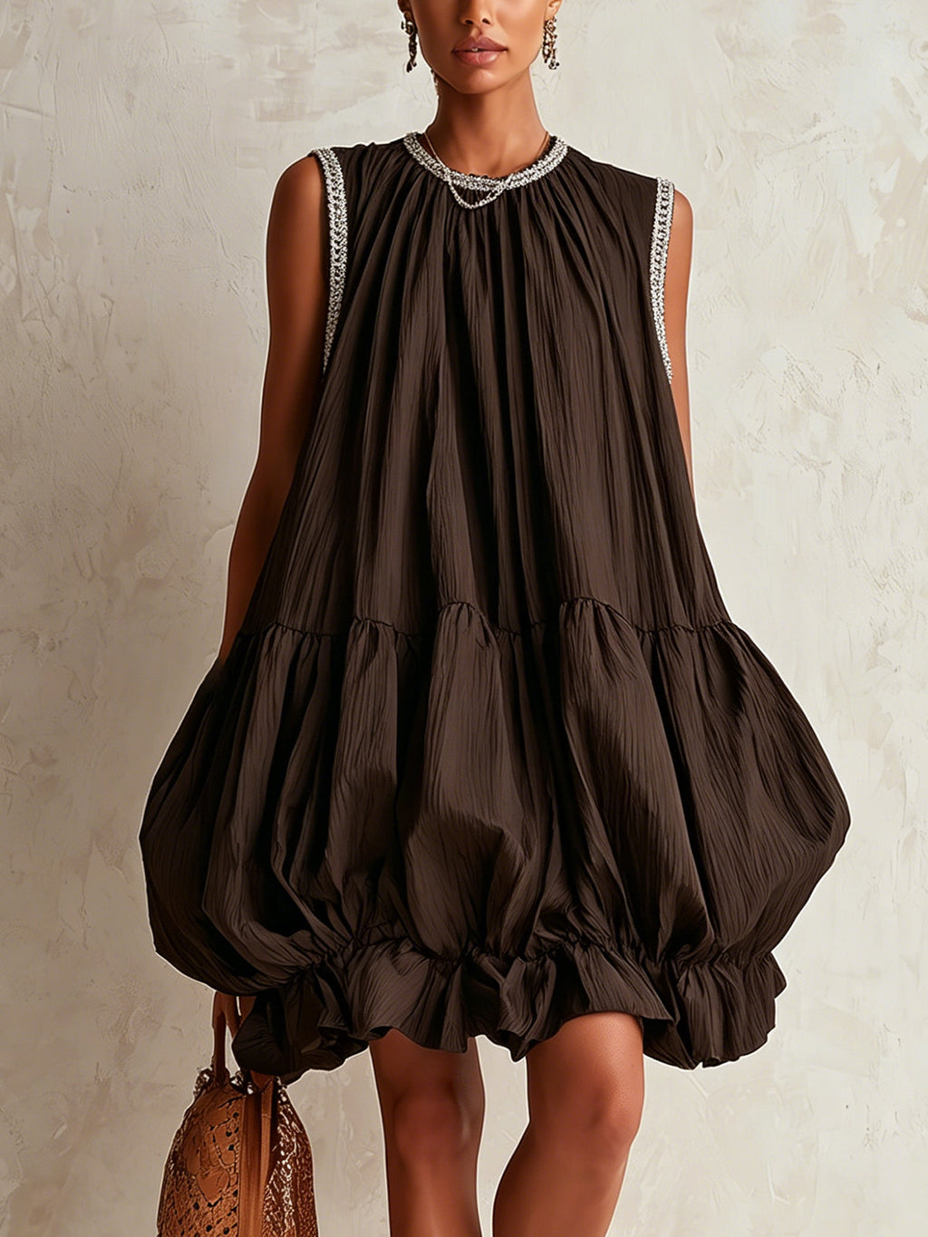 Brown sleeveless mini dress with a bubble hem