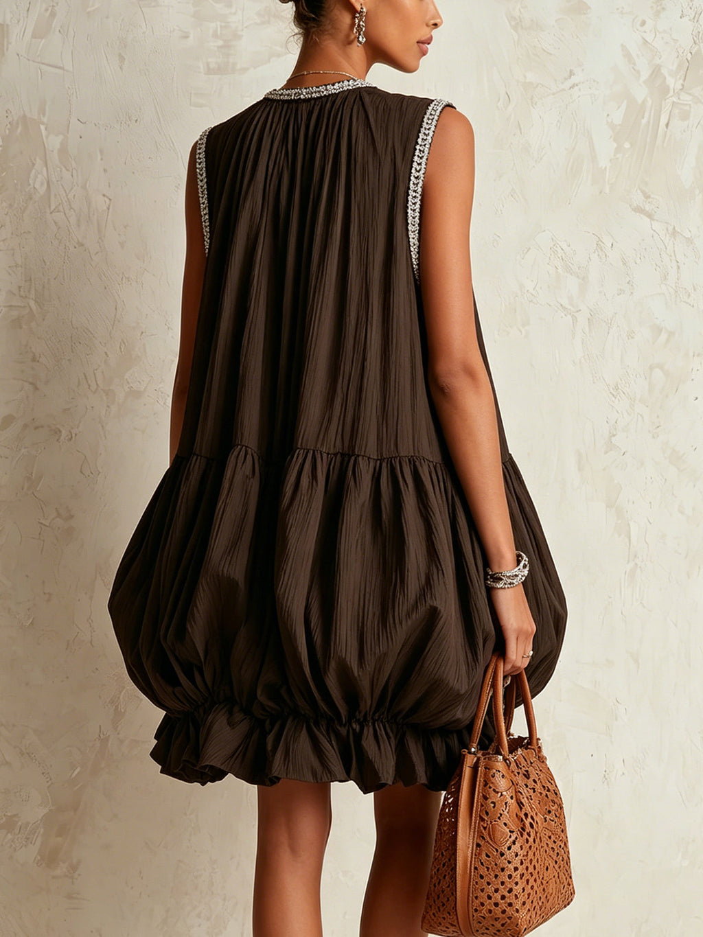 Brown sleeveless mini dress with a bubble hem