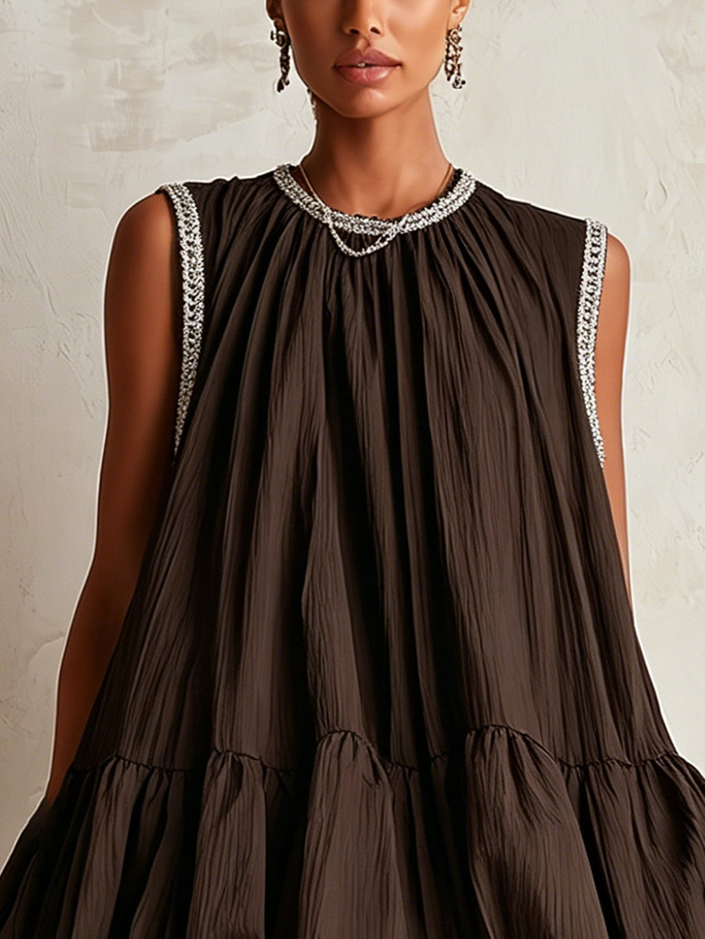 Brown sleeveless mini dress with a bubble hem