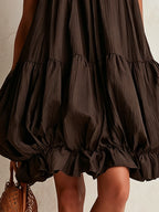 Brown sleeveless mini dress with a bubble hem
